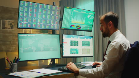 Stock-market-broker-pointing-at-monitor-computer