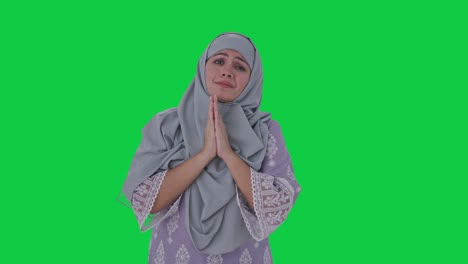 Guilty-Muslim-woman-saying-sorry-and-apologizing-Green-screen