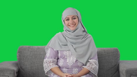 Happy-Muslim-woman-greeting-with-Adaab-Green-screen