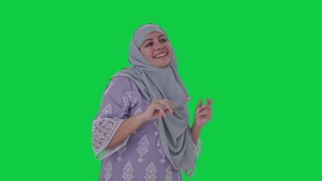 Happy-Muslim-woman-dancing-and-enjoying-Green-screen