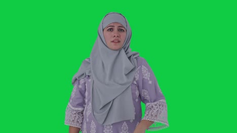 Upset-Muslim-woman-flying-a-bee-Green-screen