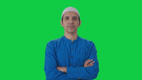 Confident-Muslim-man-standing-crossed-hands-Green-screen