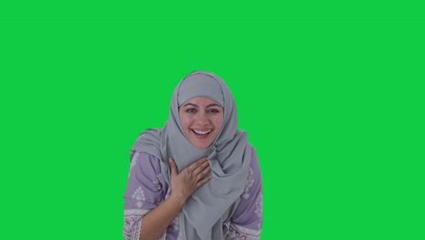 Happy-Muslim-woman-laughing-on-someone-Green-screen