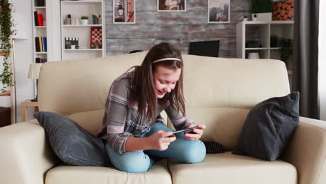 Cheerful-little-girl-playing-video-games