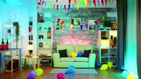 Party-decorated-room-with-neon-lights-on-the-wall-and-a-disco-ball