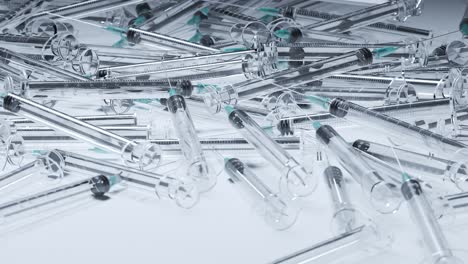 A-pile-of-used-generic-plastic-disposable-syringes.-Medical-waste.-Empty-clear-plastic-syringes.-Close-up-on-the-needle.-Concept-of-health,-medication,-drug-addiction,-diabetes,-vaccination.-4K