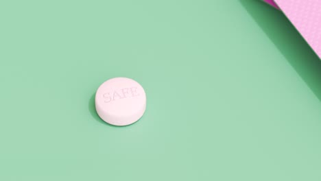 Single-pink-birth-control-pill-on-a-green-table.-Few-full-packages-of-contraceptive-pills-in-a-feminine-blister.-Clean,-colorful-animation-of-modern-anti-pregnancy-medicine.-Camera-smooth-zoom-out.