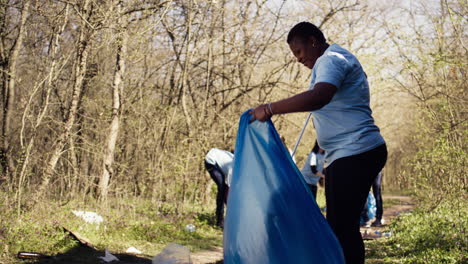 African-american-activist-doing-litter-cleanup-to-fight-illegal-dumping