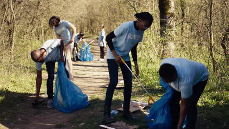 Environmental-activists-collecting-rubbish-and-plastic-waste-in-garbage-bag