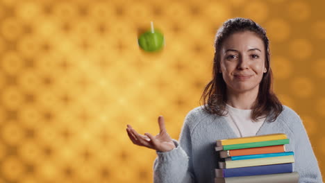Cheerful-person-holding-books,-playing-with-fresh-fruit,-good-lifestyle-concept