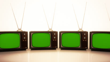 The-loopable-collection-of-an-old-fashioned-retro-color-tv-sets-with-the-antenna-tuner.-Vintage,-nostalgic-electronic-devices-stack.-Brown,-obsolete-television-is-displaying-a-green-screen.