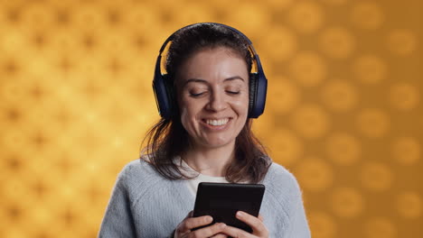 Voice-actor-smiling-while-reading-ebook,-portraying-proud-and-sassy-character