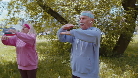 Athletic-fitness-senior-sport-man-woman-grandparents-training-cardio-workout-in-park-at-morning