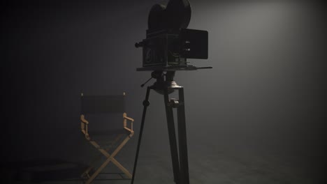 Director-chair-and-retro-video-camera-on-a-movie-set-in-a-dense-fog.-Soft,-dim-spotlight-illuminates-silhouettes-creating-light-shafts.-Climatic,-moody-atmosphere-hinting-classy-film-entertainment.
