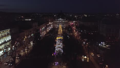 Arial-view-of-Christmas-tree-and-Fair-in-city-Lviv,-Ukraine-near-Opera-House,-New-year-holidays