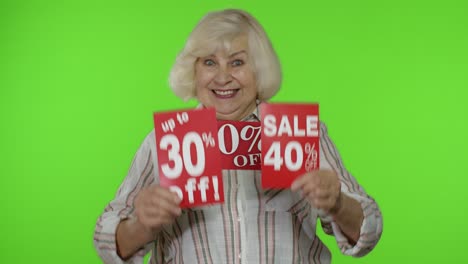 Senior-woman-showing-sale-percent-discounts-advertisement-inscriptions-banners.-Black-Friday