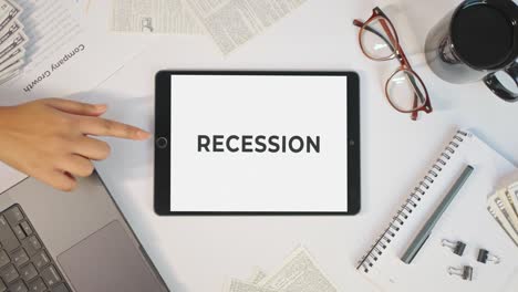 Rezession-Wird-Auf-Einem-Tablet-Bildschirm-Angezeigt