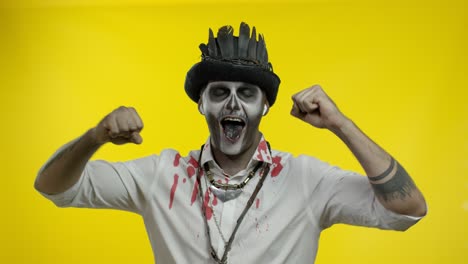 Scary-guy-in-costume-of-Halloween-skeleton-wearing-earphones,-listening-music,-dancing,-celebrating