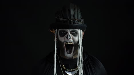 Frightening-man-in-skeleton-Halloween-cosplay-costume.-Guy-in-creepy-skull-makeup-making-faces