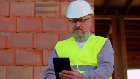 Eengineer-architect-specialist-operate-with-digital-tablet-to-control-working-at-construction-site