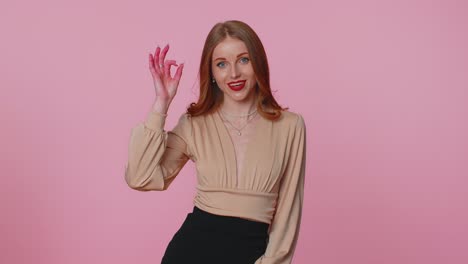 Positive-businesswoman-girl-showing-ok-gesture,-like-sign-positive-something-good-on-pink-background