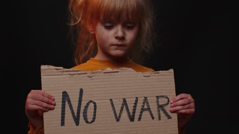 Upset-poor-toddler-child-girl-homeless-protesting-war-conflict-raises-banner-with-inscription-No-War