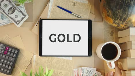 Gold-Wird-Auf-Dem-Bildschirm-Eines-Finanz-Tablets-Angezeigt