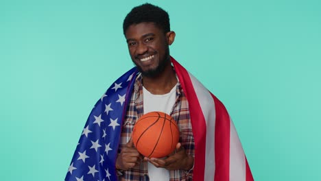 Bearded-young-man-basketball-fan-holding-American-USA-flag-doing-winner-gesture,-dancing-alone