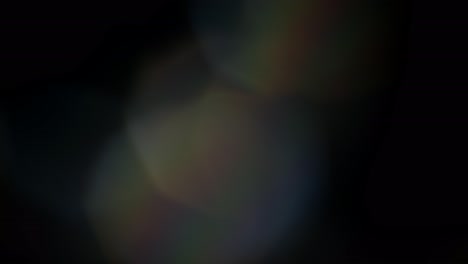 Mehrfarbige-Lichtlecks-4K-Videos-Auf-Schwarzem-Hintergrund,-Überlagerungen-Von-Linsenstudio-Flare-Leck-Bursts