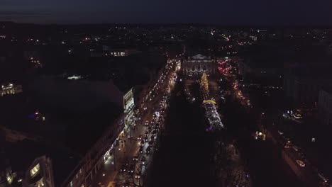 Arial-view-of-Christmas-tree-and-Fair-in-city-Lviv,-Ukraine-near-Opera-House,-New-year-holidays