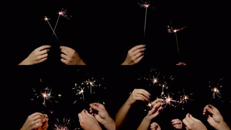 Hands-holding-and-waving-Bengal-fires.-New-year-sparkler-candle-burning-on-a-black-background