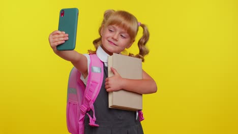 Teenage-student-girl-kid-blogger-in-school-uniform-taking-selfie-on-mobile-phone-for-social-media