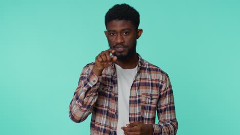 Cheerful-african-american-man-looking-at-camera-doing-phone-gesture-like-says-hey-you-call-me-back