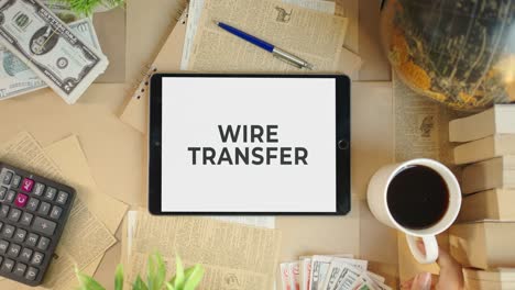 WIRE-TRANSFER-DISPLAYING-ON-FINANCE-TABLET-SCREEN