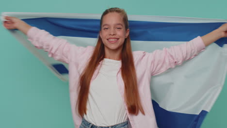 Teen-girl-kid-in-shirt-top-waving-and-wrapping-in-Israel-national-flag,-celebrating-Independence-day