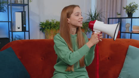 Young-caucasian-teen-girl-talking-with-megaphone,-proclaiming-news,-loudly-announcing-advertisement