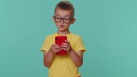 Worried-funny-toddler-children-boy-kid-playing-online-racing-or-shooter-video-games-on-smartphone