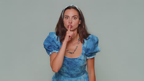 Pretty-scared-woman-presses-index-finger-to-lips-makes-silence-gesture-sign-do-not-tells-secret