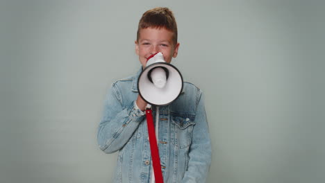 Smiling-toddler-boy-talking-with-megaphone,-proclaiming-news,-loudly-announcing-sale-advertisement