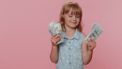 Successful-rich-child-girl-kid-holding-money-cash-dancing-listening-music-lottery-game-win-income