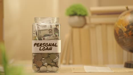 PERSON-SAVING-MONEY-FOR-PERSONAL-LOAN