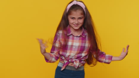 Trendy-cheerful-positive-happy-child-girl-kid-dancing-and-moving-to-rhythm-making-dub-dance-gesture