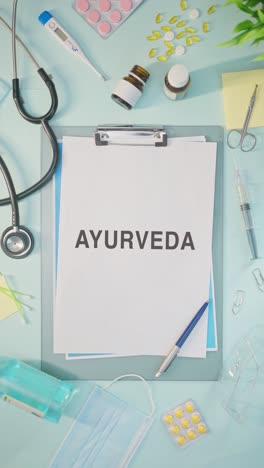 VERTICAL-VIDEO-OF-AYURVEDA-WRITTEN-ON-MEDICAL-PAPER
