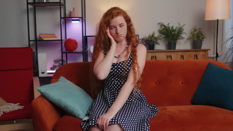 Thoughtful-inspired-redhead-young-woman-make-Eureka-gesture-raises-finger-came-up-with-creative-plan