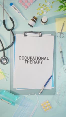 VERTICAL-VIDEO-OF-OCCUPATIONAL-THERAPY-WRITTEN-ON-MEDICAL-PAPER