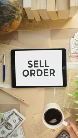 VERTICAL-VIDEO-OF-SELL-ORDER-DISPLAYING-ON-FINANCE-TABLET-SCREEN