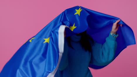 Pretty-teen-girl-waving-European-Union-flag,-smiling,-cheering-democratic-laws-human-rights-freedoms