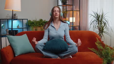 Girl-breathes-deeply-with-mudra-gesture,-eyes-closed,-meditating-with-concentrated-thoughts-peaceful