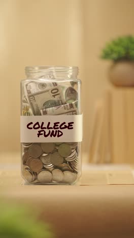 VERTICAL-VIDEO-OF-PERSON-SAVING-MONEY-FOR-COLLEGE-FUND