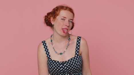 Redhead-woman-showing-tongue-making-faces-at-camera,-fooling-around,-joking,-aping-with-silly-face